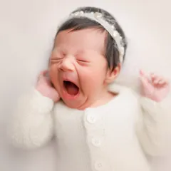 We can't miss capturing those tiny little yawns. They are one of the most adorable and fleeting expressions of a newborn, and they make for such a cute and memorable photo.