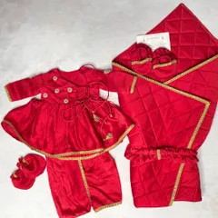 A variation of our Jamna set, this one features a peplum top and dhoti pants for a baby girl, also in festive red velvet.