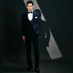Get ready to turn heads with this dark blue velvet suit, embellished with sequins for a bold and stylish flair.