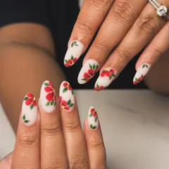 A closer look at this elegant, hand-painted floral design. The vibrant red flowers with green leaves pop against the soft, matte white background, creating a timeless and artistic look.