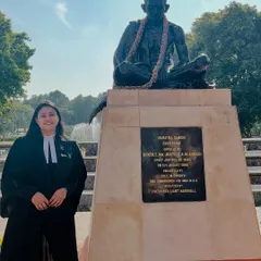 At the Supreme Court, standing before the statue of Mahatma Gandhi. His principles of truth and justice are a guiding light for every argument I make and every case I fight.