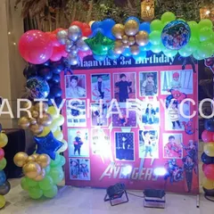 A personalized Avengers photo milestone board, flanked by cutouts of Black Widow and Iron Man on colorful balloon columns.