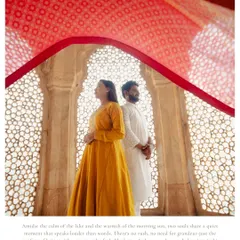 Using the bride's vibrant red dupatta to frame this shot created a beautiful, intimate moment. Set against the intricate latticework of an Udaipur palace, this photo feels quiet, artistic, and deeply romantic.