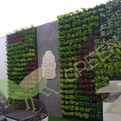 Turn a plain wall into a stunning masterpiece with my artificial vertical gardens. This client's terrace now features a serene, vibrant green wall that provides a beautiful backdrop for their seating area. These UV-protected mats ensure the colors stay rich and true, with absolutely no maintenance needed.