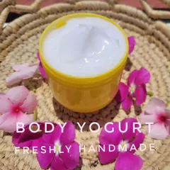 A scoop of my creamy white Body Yogurt, surrounded by fresh flowers. This moisturizer is lightweight but provides deep hydration, leaving your skin feeling soft and smooth.