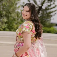 A beautiful shot of the bride looking over her shoulder. Her skin is glowing, and the makeup is natural yet polished.