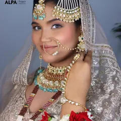 A close-up of the Pakistani bridal look, showing the intricate details of the jewelry and the soft, glowing makeup that enhances the bride's natural beauty.
