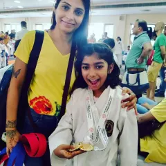 There is no greater joy than seeing my students succeed. This young warrior proudly shows off her medal after a championship, a result of her hard work and dedication.