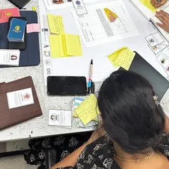 A close-up of the collaborative process during a workshop. We use hands-on tools like maps, sticky notes, and role-playing cards to simulate real-world urban planning challenges and encourage creative problem-solving.
