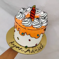 An orange comic cake with a cartoon candle. I can customize the colors to match any party theme.
