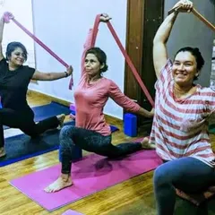 The energy in our group sessions is incredible. Here, we are using resistance bands to deepen the stretch in a lunge variation, building strength and flexibility together. It is all about progress, not perfection, and sharing a smile along the way.