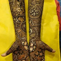 A beautiful bridal design combining a traditional bride portrait with paisleys and floral work. The use of negative space makes the central figure stand out.