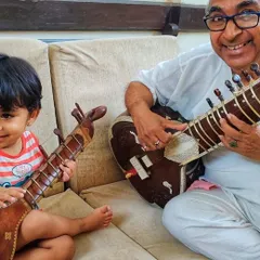 The love for music runs deep in my family. Here is my Baba, my first Guru, sharing a moment with my nephew and his own small sitar. This image perfectly captures my belief that music education is a gift to be passed down through generations, starting from a young age.