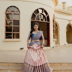 A full view of Brunda's elegant langa voni, showcasing the beautiful drape and flow of the converted Kanjivaram silk skirt.