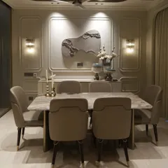 The dining area is the heart of many homes. For this space, we designed a bespoke dining table with a specially sourced Italian marble top. The chairs are fabricated with a practical leatherette front and a beautiful weave texture at the back, combining easy maintenance with elegant design.