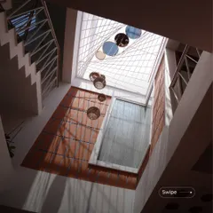 This is the heart of the Gopal Residence, where a double-height space is crowned with a unique skylight. I designed this to bring an abundance of natural light deep into the home, creating a bright, airy atmosphere that makes even a compact city plot feel spacious. The interplay of light, shadow, and natural materials like terracotta is central to my design philosophy.