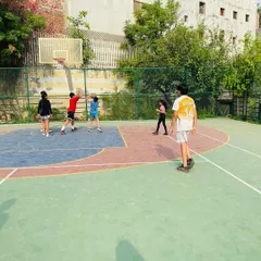 A young player from the Juniors team attempts a shot during a fun and engaging drill.
