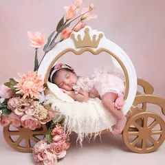 A fairytale beginning. Our princess carriage prop is perfect for creating a magical newborn portrait. Surrounded by soft florals and elegant details, your little one will look like true royalty.