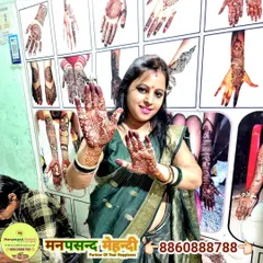 A happy client showing off her beautiful Karwa Chauth mehndi. Our studio is a popular spot for festive preparations.