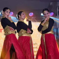 The ladies' group having a blast on stage during the Kannada Rajyotsava event. This performance was a mix of traditional and modern dance, showcasing their amazing expressions.