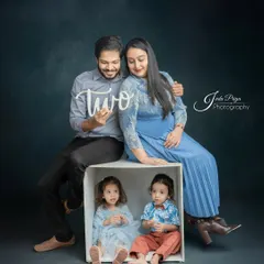 Another shot from the twins' birthday session, this one showing the mother's baby bump, celebrating both the twins turning two and the arrival of a new sibling.
