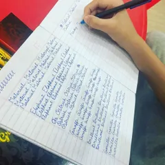 Mastering word formation is a key step in our handwriting course. This student is practicing writing words repeatedly, which helps build muscle memory for consistent and beautiful cursive script.