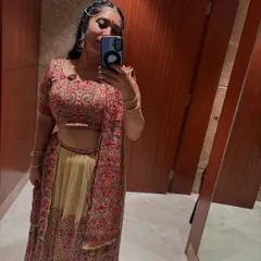 Getting ready for a Dandiya gig. I love dressing up for the occasion, and this mirror selfie shows one of my favorite lehenga choli outfits, complete with traditional jewelry, to match the event's theme.