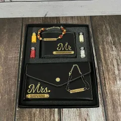 Show your love for both your brother and sister-in-law with this elegant 'Mr & Mrs' themed Rakhi combo. It features matching personalized black faux leather wallets and coordinating name bracelets for a complete gift.