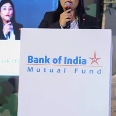 A close-up shot while speaking at the Bank of India event. I ensure every announcement is delivered with impact.