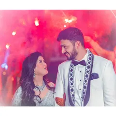 Finding my forever in you. A magical couple entry shot, surrounded by friends and the warm glow of sparklers.