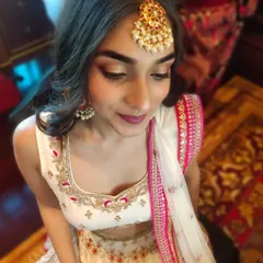 A closer look at the wedding guest's makeup, highlighting the blended eyeshadow and flawless skin. This look is perfect for guests who want to look glamorous yet elegant.