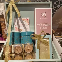 Another angle of our special edition Diwali trunk hamper, showcasing the arrangement of tea cake, tins, and glitter diyas.