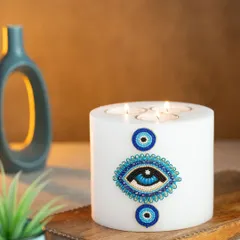 I designed this multi-wick evil eye candle to be a beautiful statement piece for your home. Made with clean-burning soy wax and adorned with a hand-beaded evil eye design, it's meant to bring positive vibes and a touch of style.