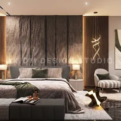 A dramatic stone bedback anchors this modern luxury bedroom. We balanced the bold texture with soft upholstery, warm ambient lighting, and abstract art to create a space with strong character.