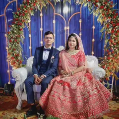 A beautiful portrait of a couple on their reception stage. I work with couples to build their confidence so they feel like stars, ready for their big performance and all the photos that come with it.