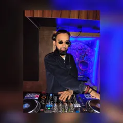 In the zone at the DJ booth. The right lighting and atmosphere in the booth help me create the perfect vibe for the crowd.