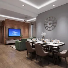 This wide shot shows how the living and dining areas flow together in an open-plan layout. We maintained a consistent design language with wooden flooring and neutral walls, while defining the two zones with distinct furniture and lighting.