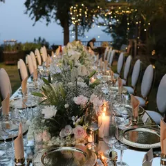 An elegant sit-down dinner I designed in the hills of Kasauli. The long mirrored table reflected the sky and the fairy lights in the trees, while a runner of white and blush pink florals added a touch of romance.