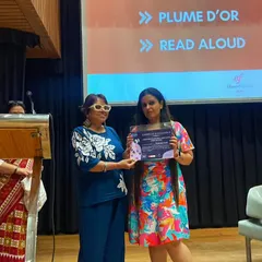 A student receiving her award during our Bastille Day celebrations. We are incredibly proud of the hard work and passion of our students.