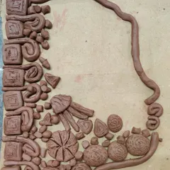 This abstract clay silhouette is filled with a variety of shapes and textures. It's a fantastic exploration of form and composition.