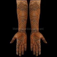 A classic and symmetrical design suitable for a bridesmaid or guest. It features floral and paisley patterns that cover the hands and extend partially up the arm.
