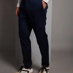 The foundation of a great outfit often starts with the right trousers. This image details the side-adjuster on a pair of my bespoke navy trousers, a feature that ensures a perfect fit without a belt.
