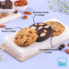 A trio of our gourmet cookies: the chewy Apricot Pecan, the rich Brownie Crinkle, and the perfectly balanced Chocolate Seasalt.
