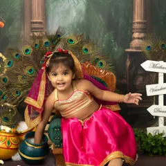 A beautiful little Radha with a happy, playful expression. The Janmashtami set is perfect for capturing the divine charm of both boys and girls.