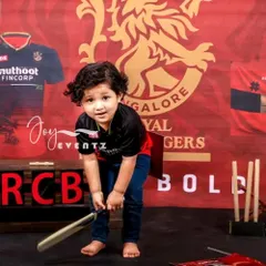 For the little cricket fan in your family, we offer a custom RCB theme photoshoot. We set the stage with the official team jersey, logo, and cricket props to capture your child's sporting spirit.