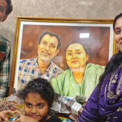 A family celebrating with their new custom couple's portrait. I painted this piece in acrylics as a special anniversary gift.