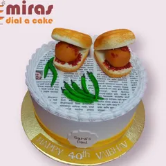 A cake that celebrates Mumbai's favorite street food! This incredibly realistic Vada Pav cake, complete with edible newspaper and green chilies, is a fun and surprising treat for a 40th birthday.