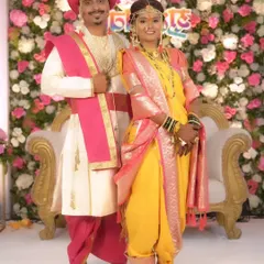 A beautiful Maharashtrian couple on their wedding day, dressed in traditional yellow and pink attire. I ensure both bride and groom look coordinated and picture-perfect.