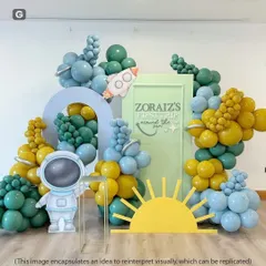 A modern space theme with an olive green, yellow, and blue color palette, featuring a cute astronaut cutout and a rocket prop.