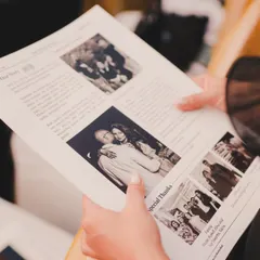 To share their story in a unique way, we created a custom wedding newspaper for the guests. It included their love story, photos, and a special thank you to their families, making for a wonderful keepsake.